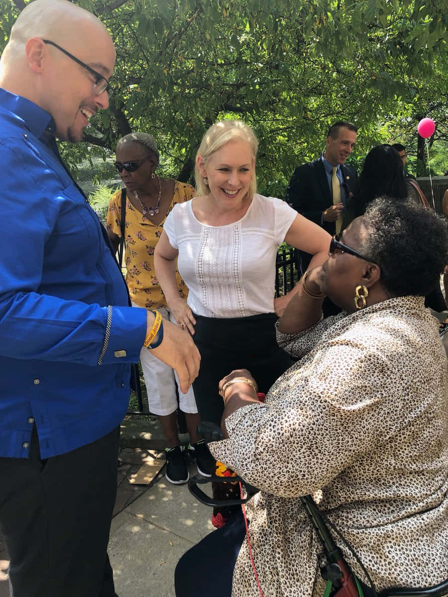 Kirsten Gillibrand With People Outside Background
