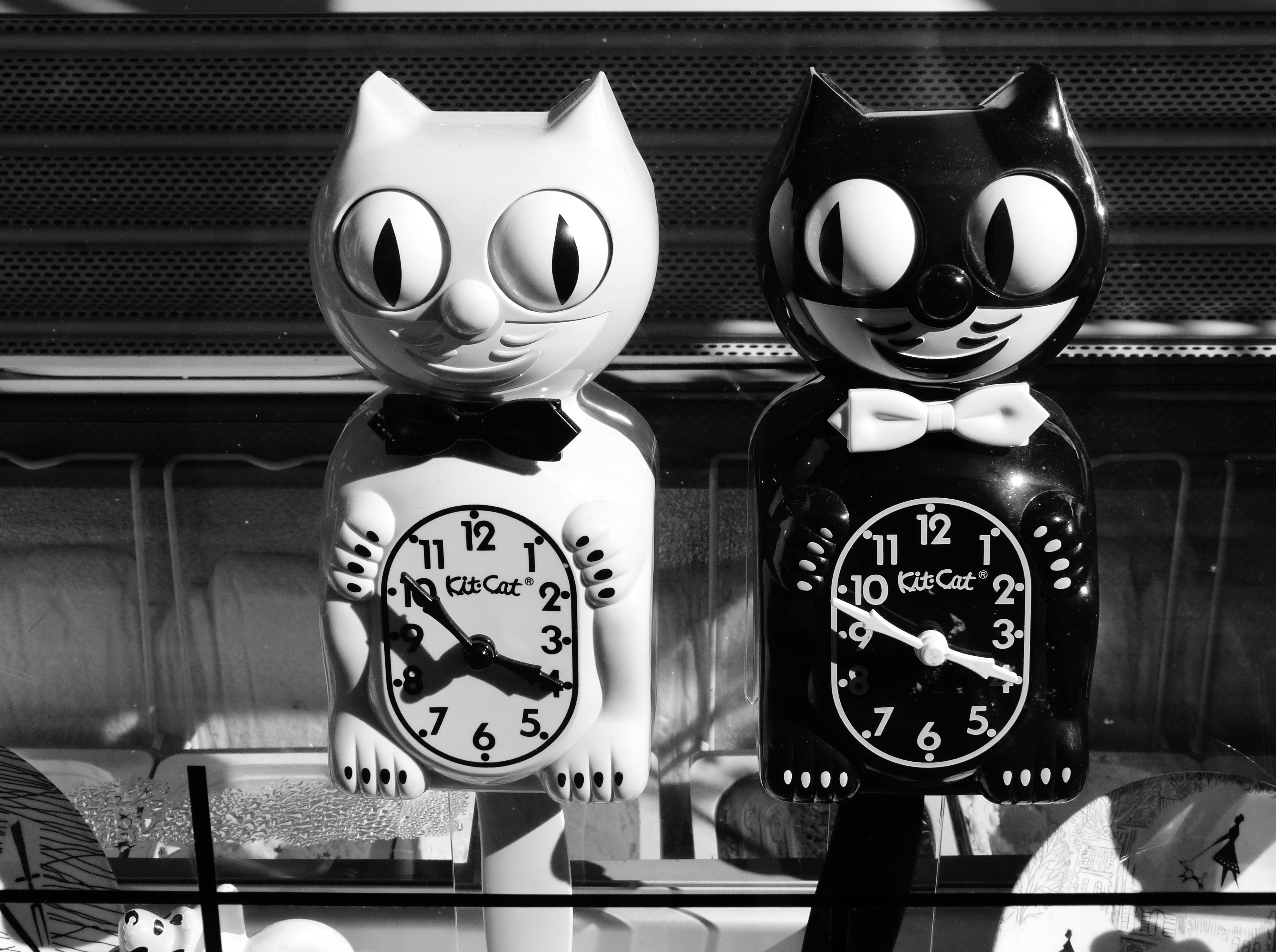 Kit-cat Clocks Black And White Background