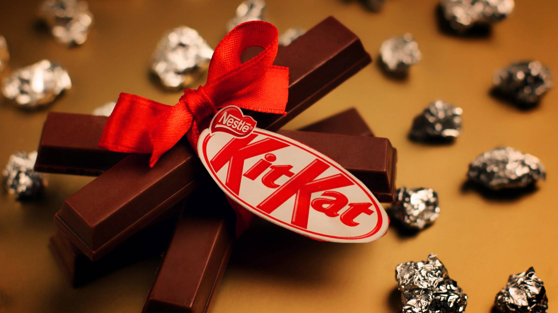 Kit Kat With A Red Ribbon Background