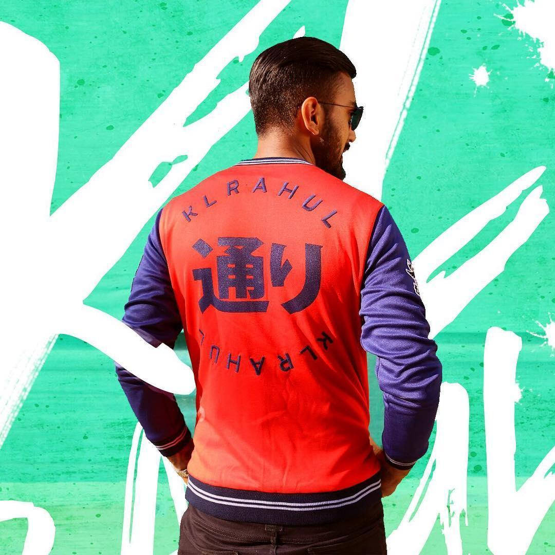 Kl Rahul Wearing A Red Fitted Varsity Jacket Background