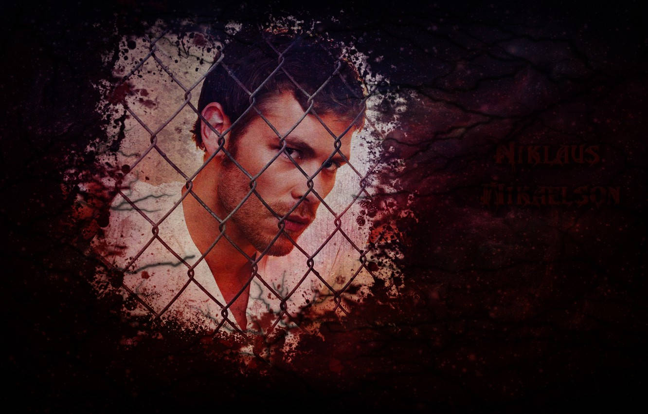 Klaus Mikaelson Behind Chain Link Fence
