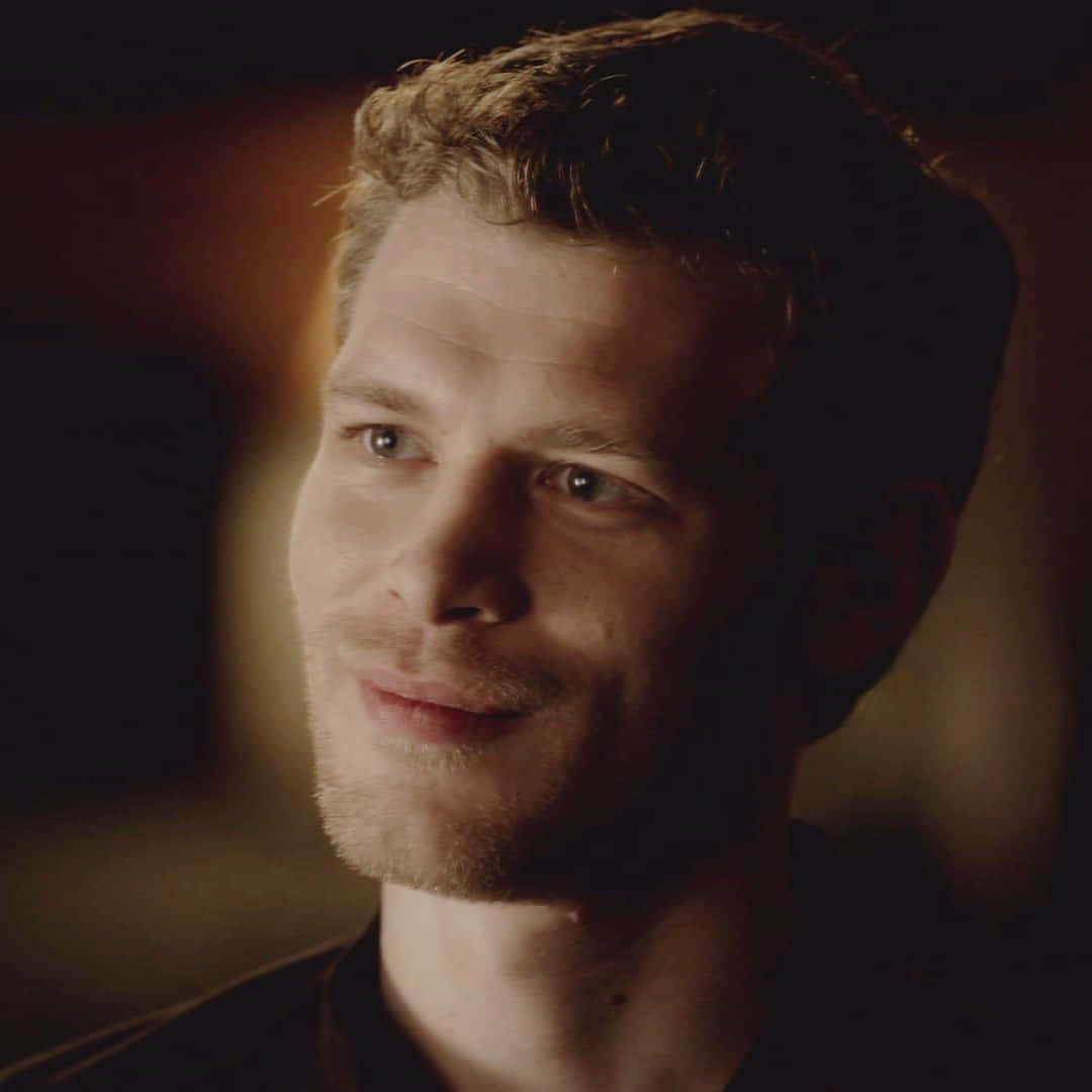 Klaus Mikaelson Captured In A Smiling Moment Background