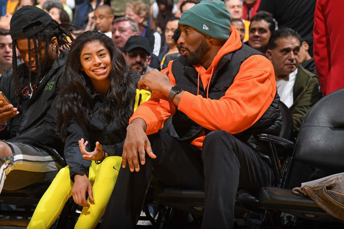 Kobe And Gianna Bryant Celebrating A Lakers Victory Background