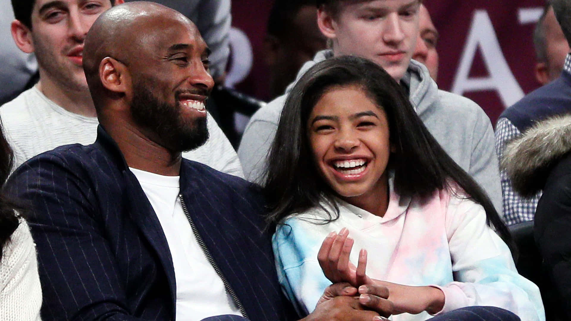 Kobe And Gigi Bryant Smiling Together Background