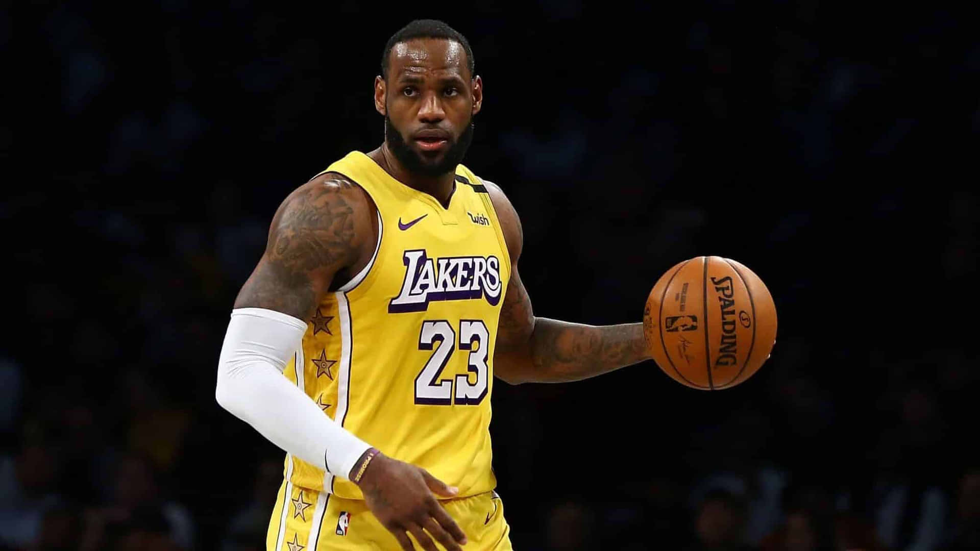 Kobe Bryant And Lebron James Shows Sportsmanship After A Competitive Basketball Game Background