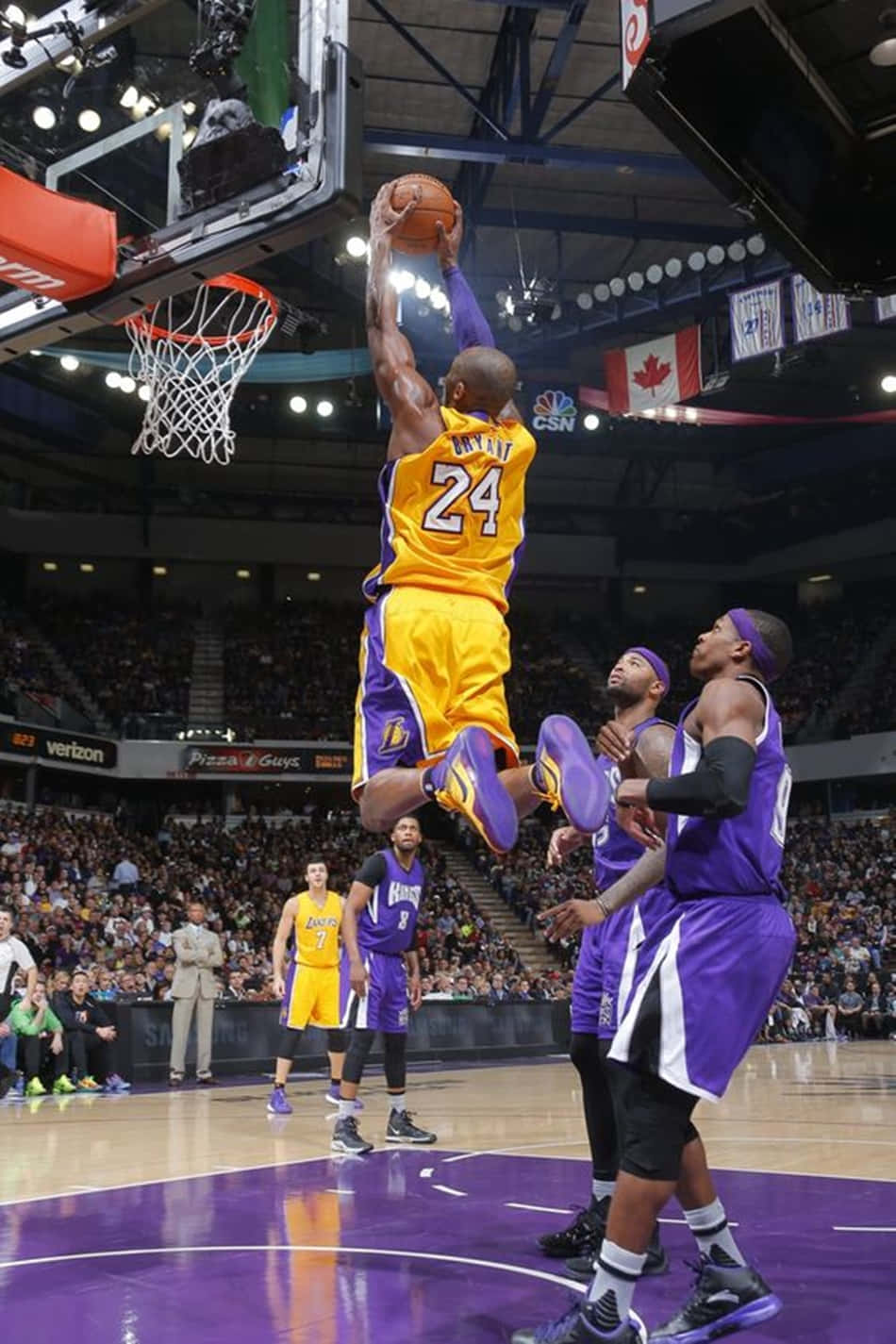 Kobe Bryant Dunks Over A Defender Background