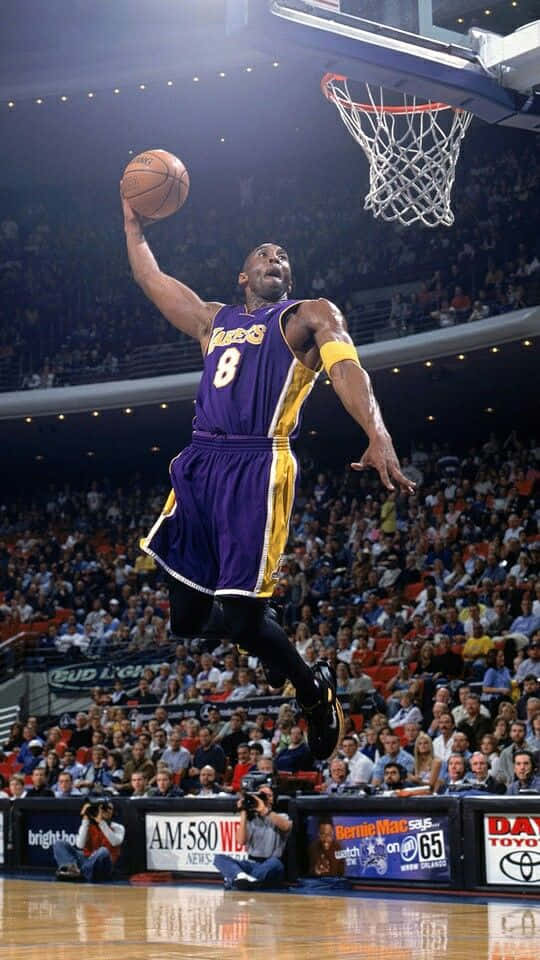 Kobe Bryant Skies To The Hoop Background
