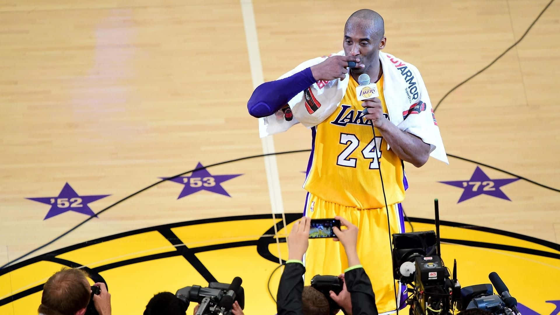 Kobe Bryant Speaks To Reporters On The Court Background