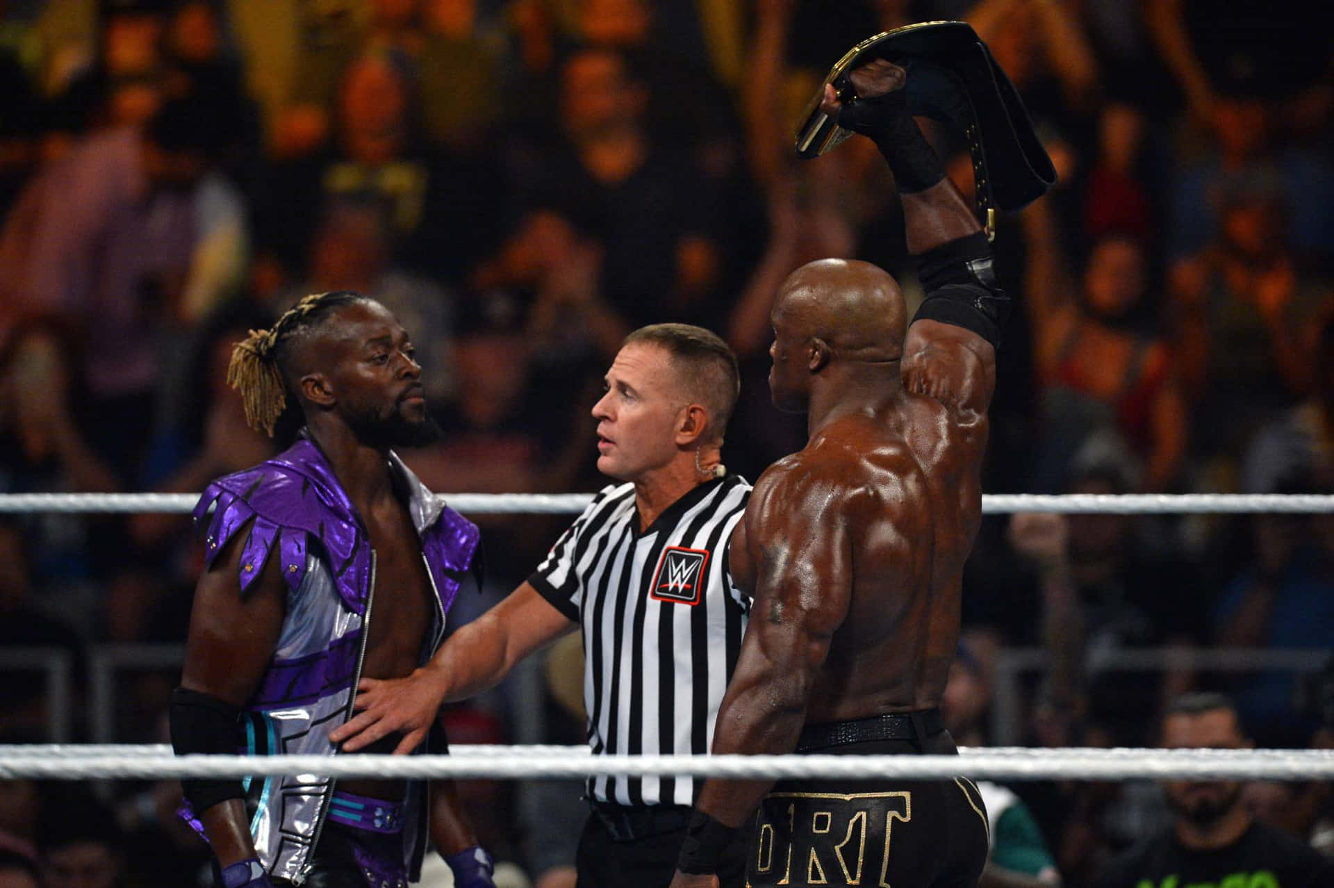 Kofi Kingston Against Bobby Lashley Background