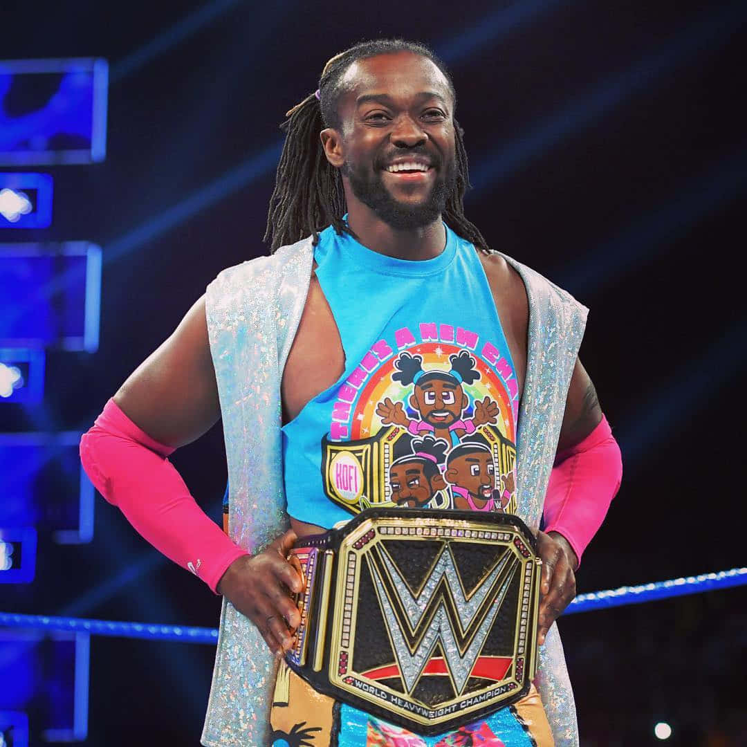 Kofi Kingston In A Multi-colored Attire With A Wwe Belt