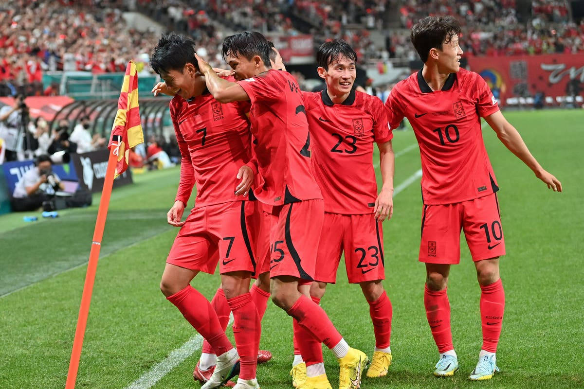 Korea Republic National Football Team Showing Off Their Skills And Unity On The Field Background