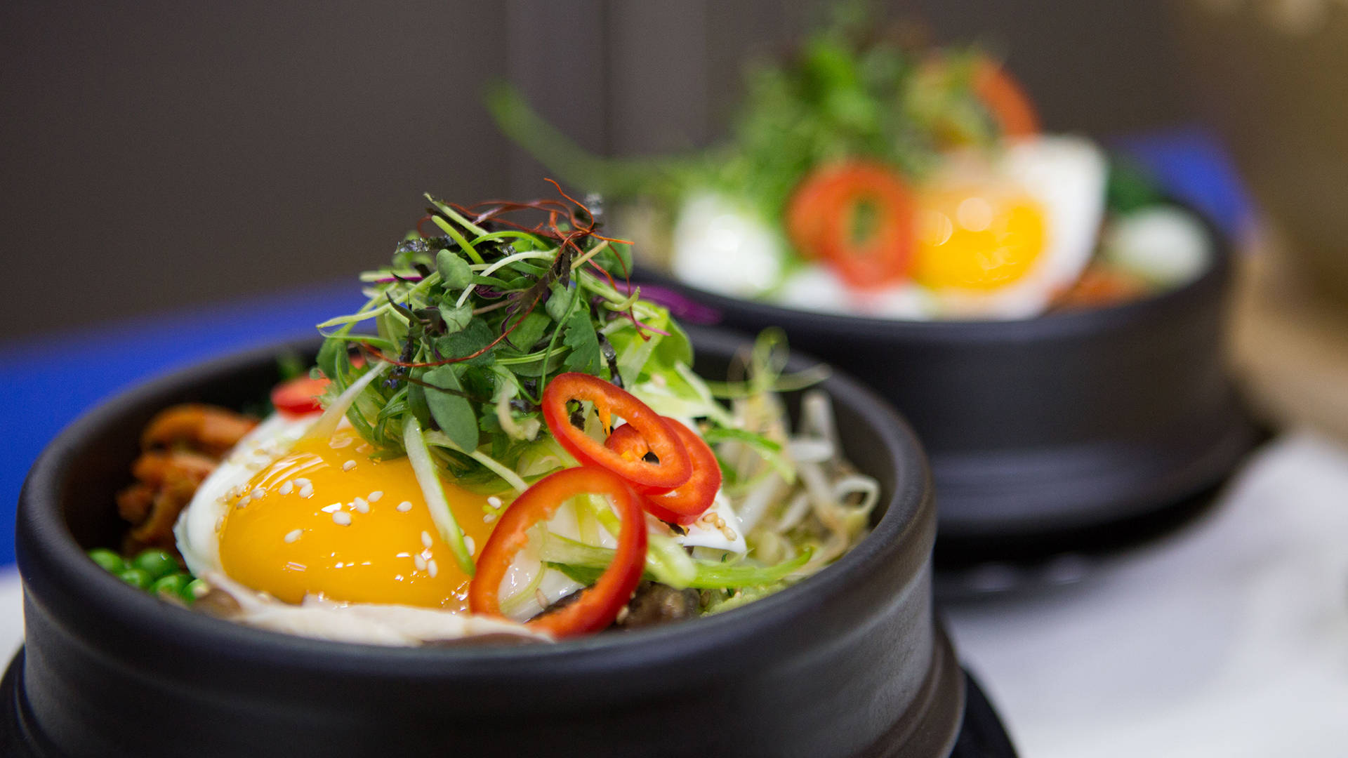 Korean Bibimbap With Peppers And Greens Background