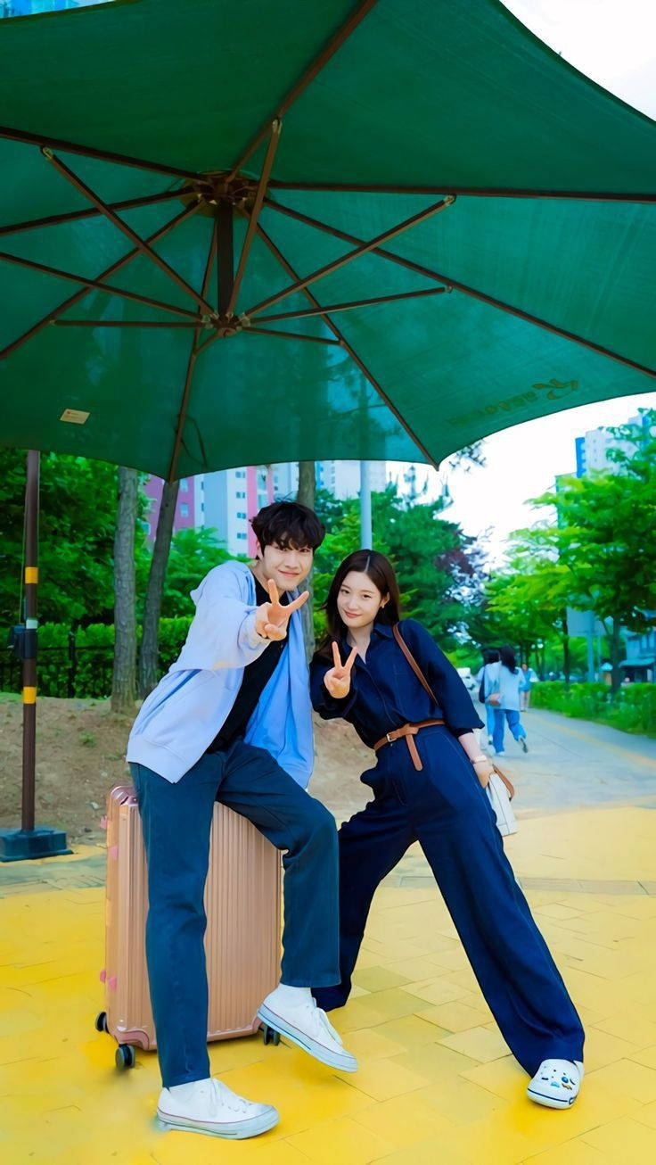 Korean Couple Doing Peace Sign