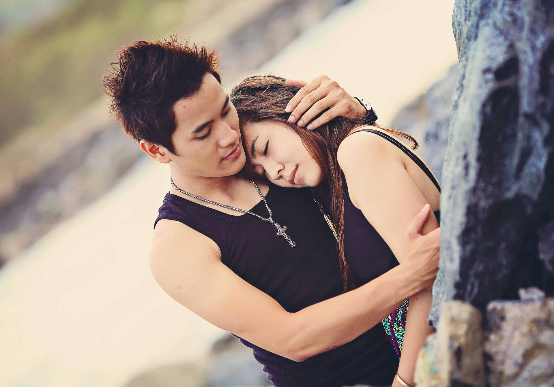 Korean Couple In Sleeveless Black Tops Background