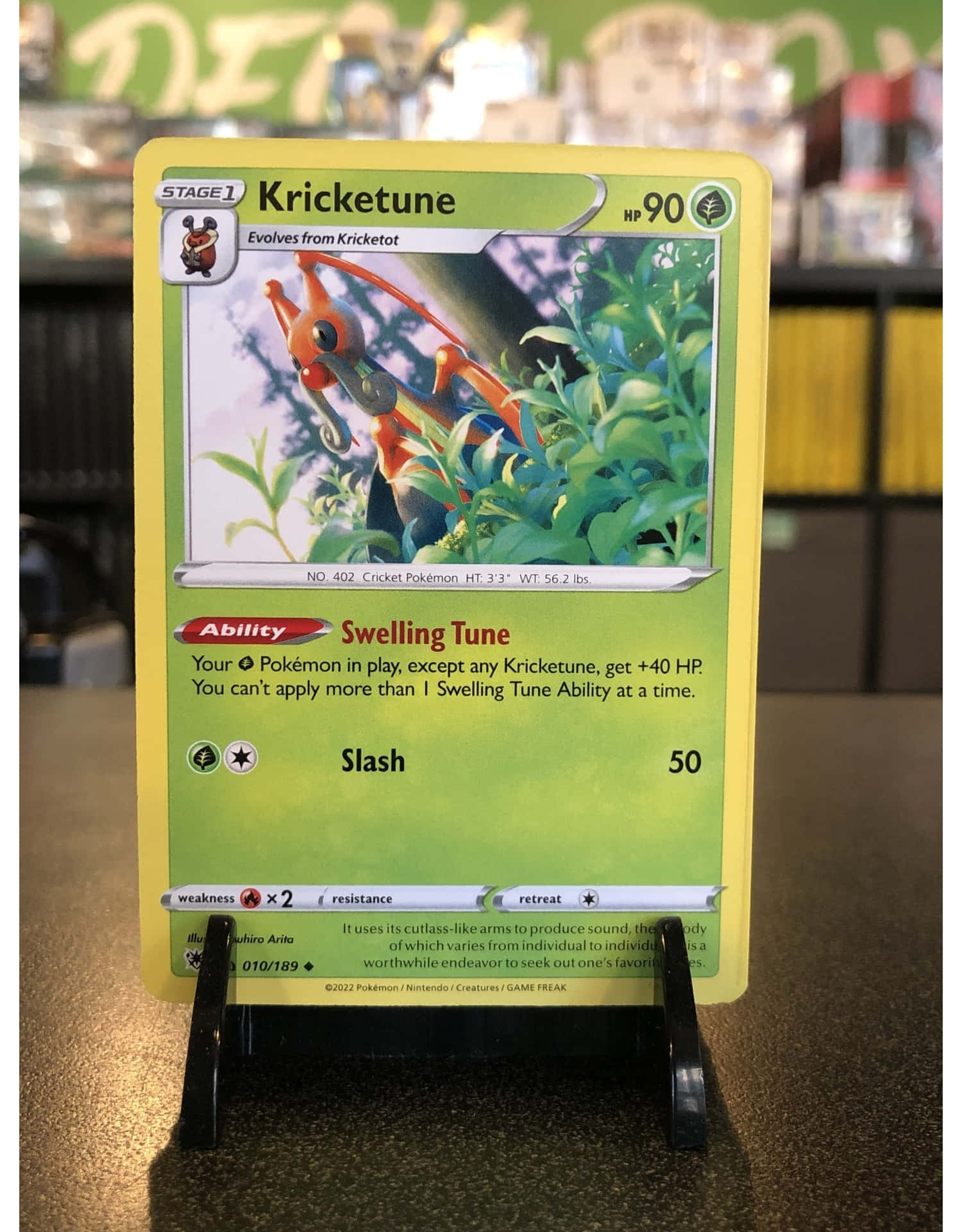 Kricketune Trading Card On Black Stand