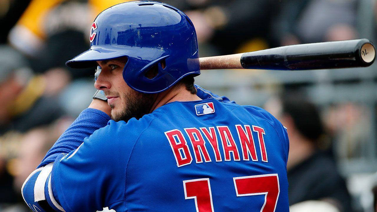 Kris Bryant Batting In Blue Uniform Background