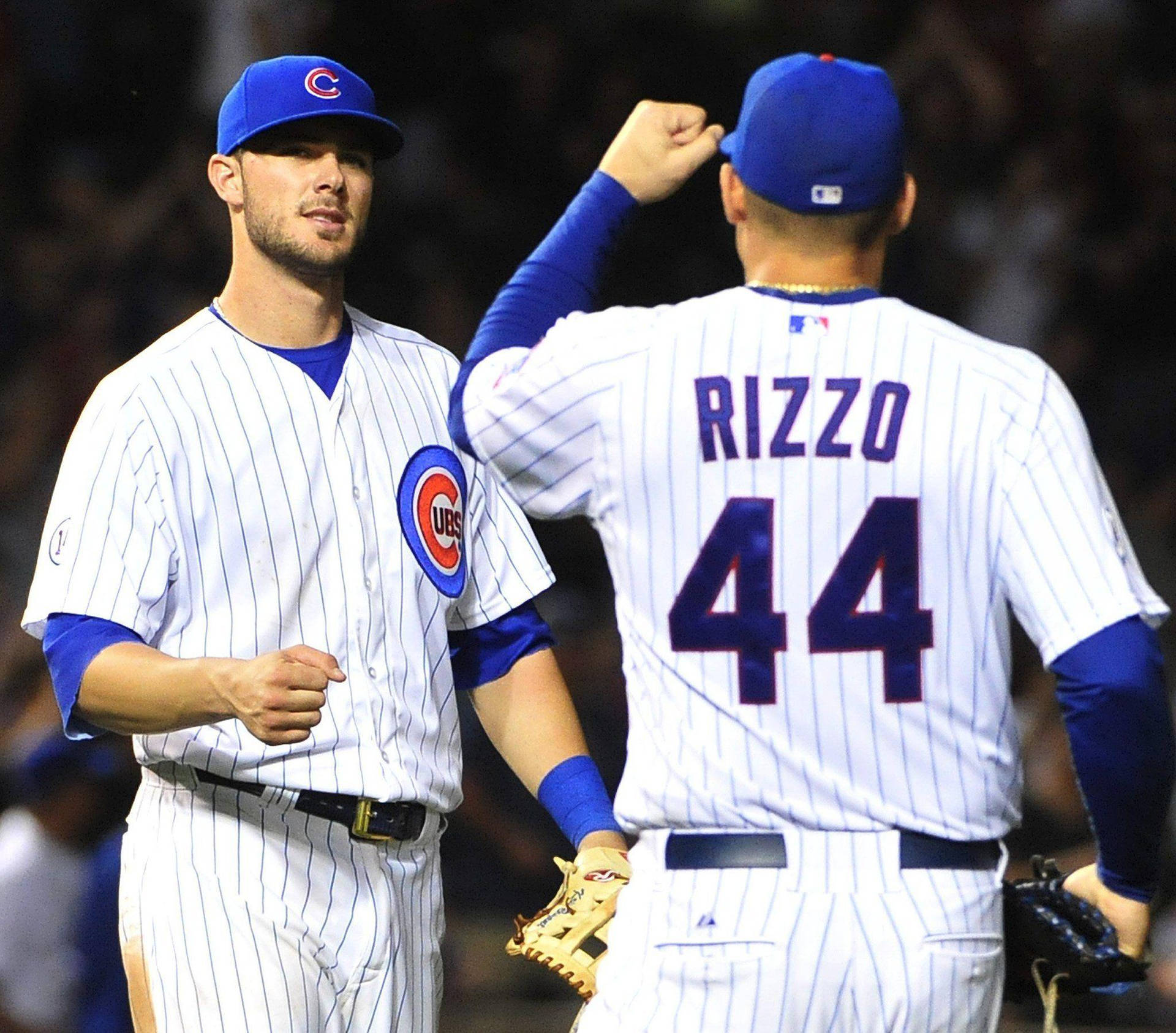 Kris Bryant Fist Bumping With Rizzo Background