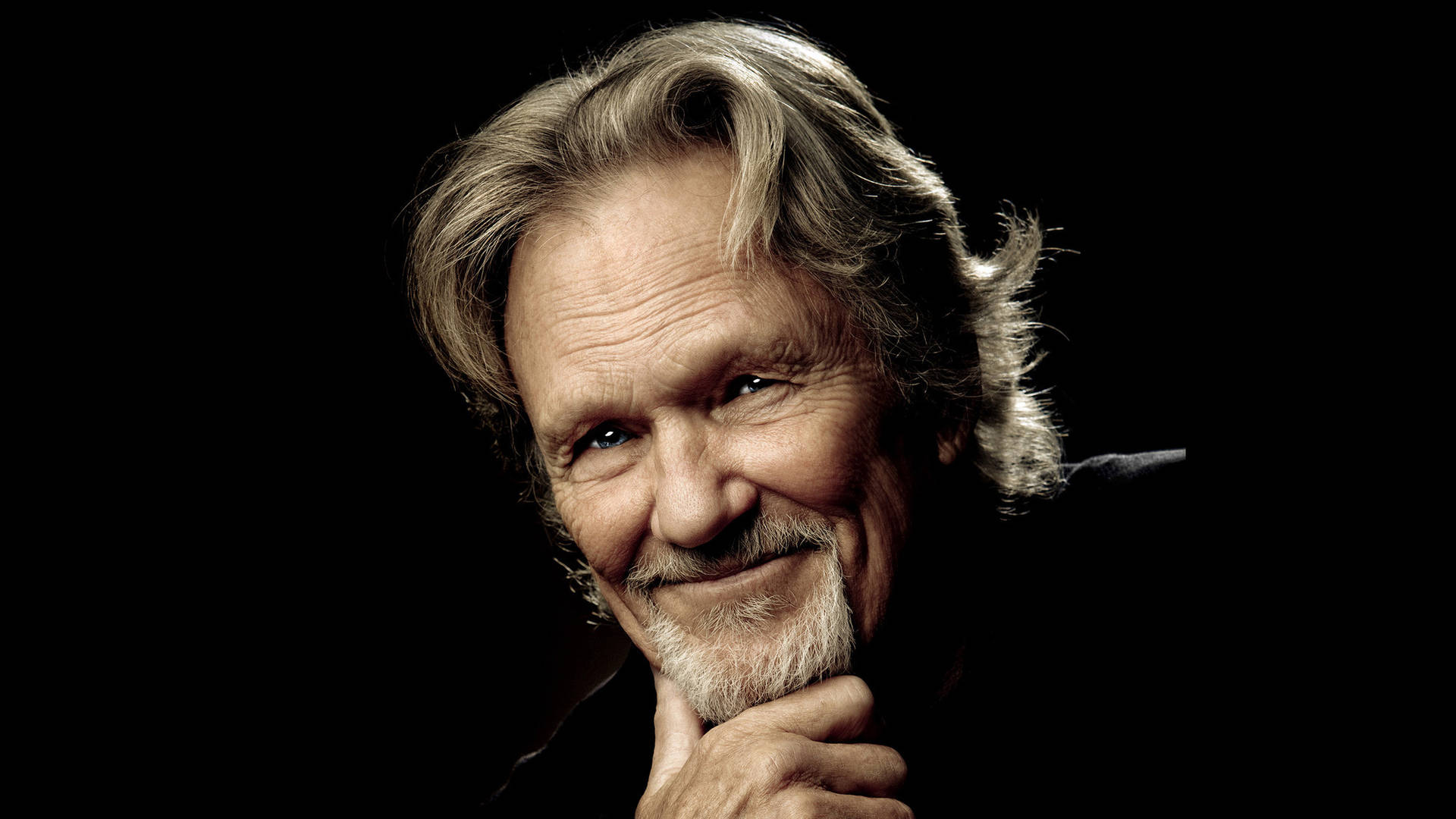 Kris Kristofferson On A Dark Background