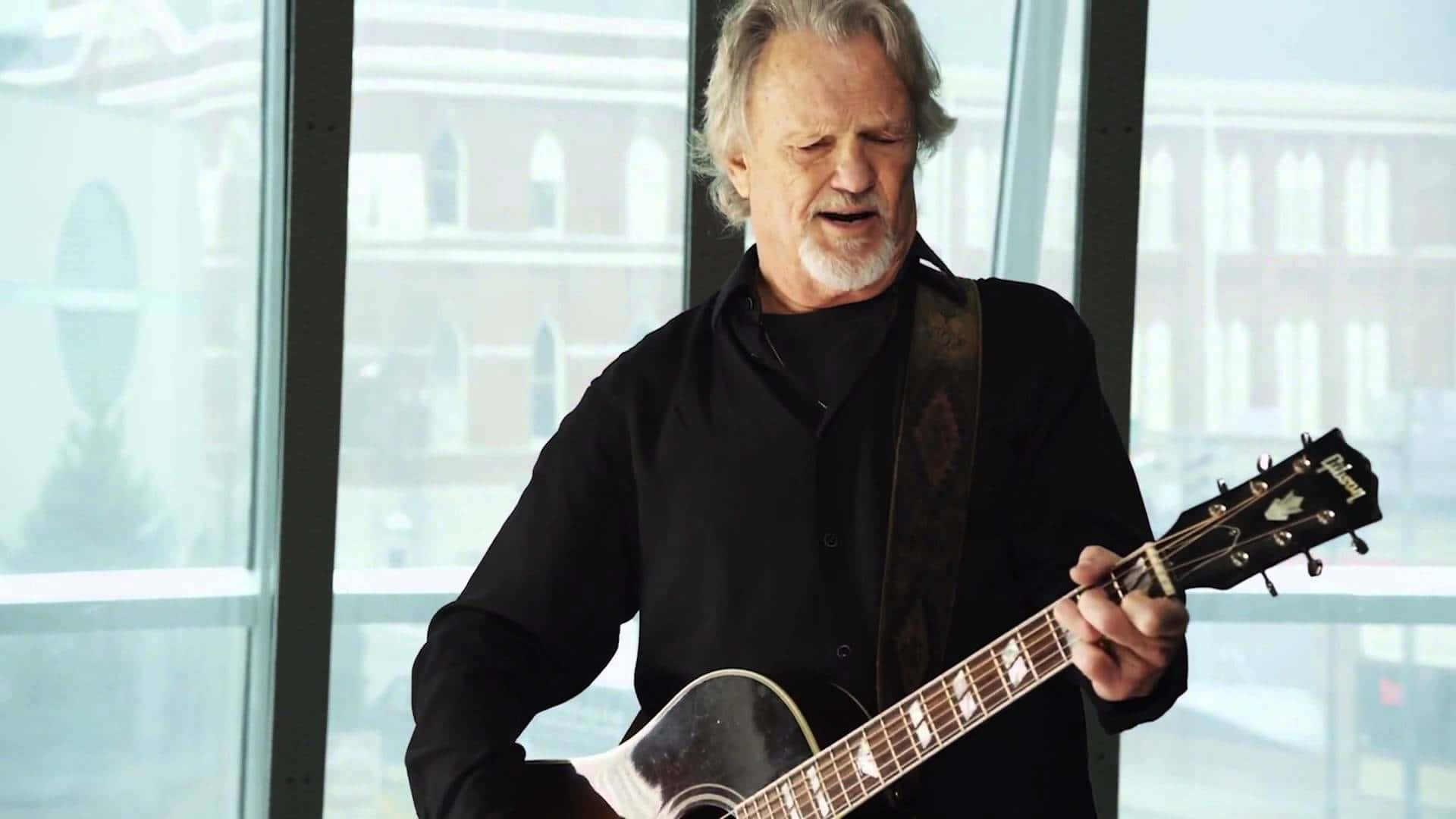 Kris Kristofferson Performing Guitar Background