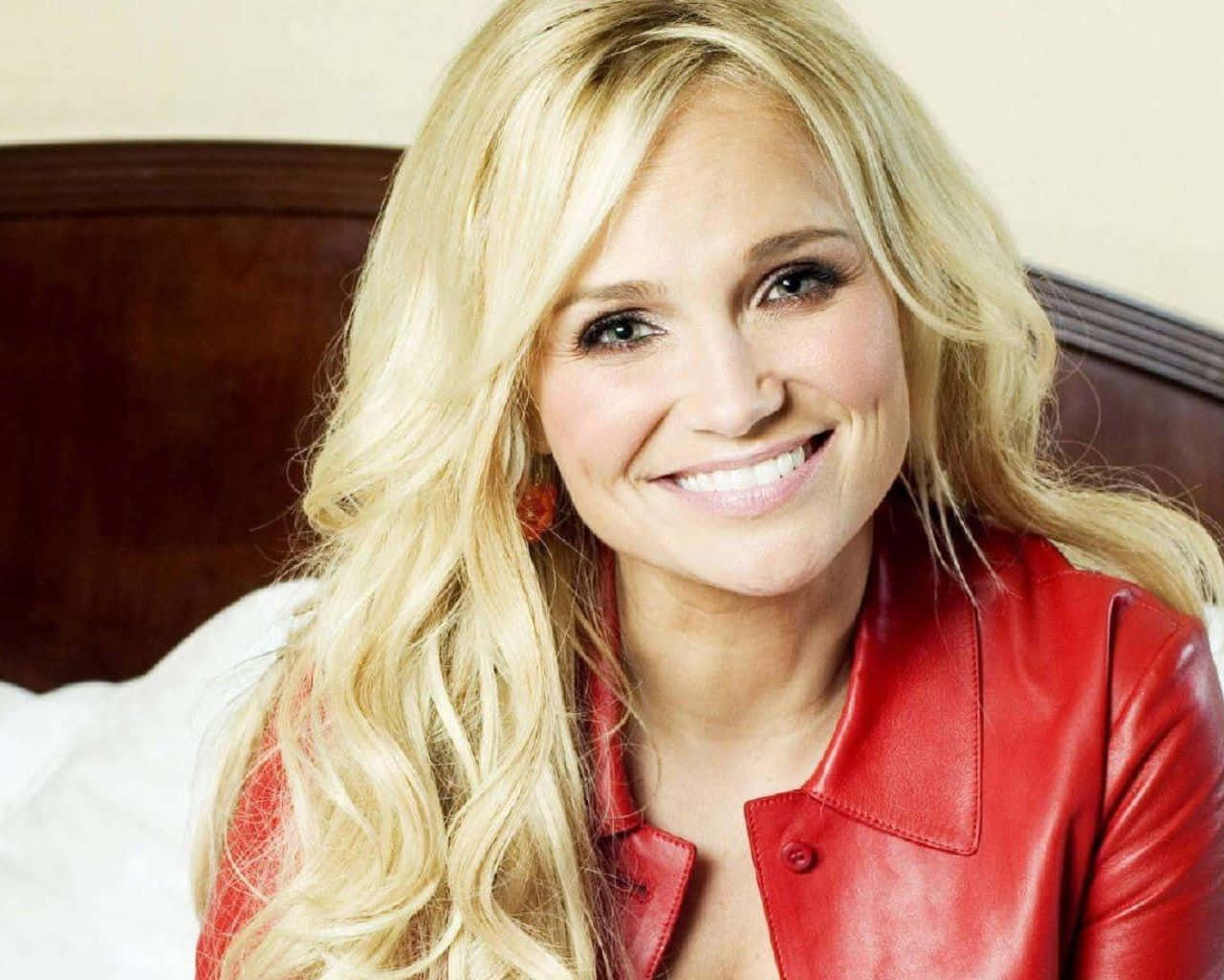 Kristin Chenoweth Posing Elegantly In A Stunning Outfit Background