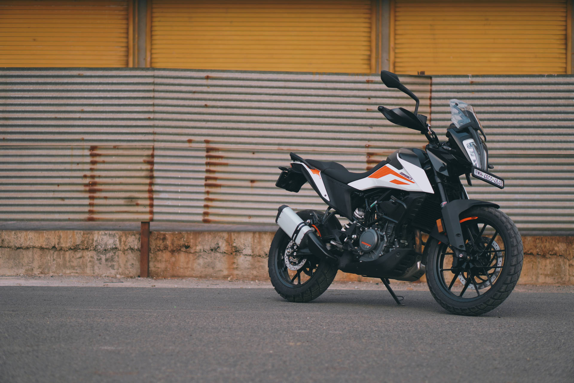 Ktm Bike On Pavement Background