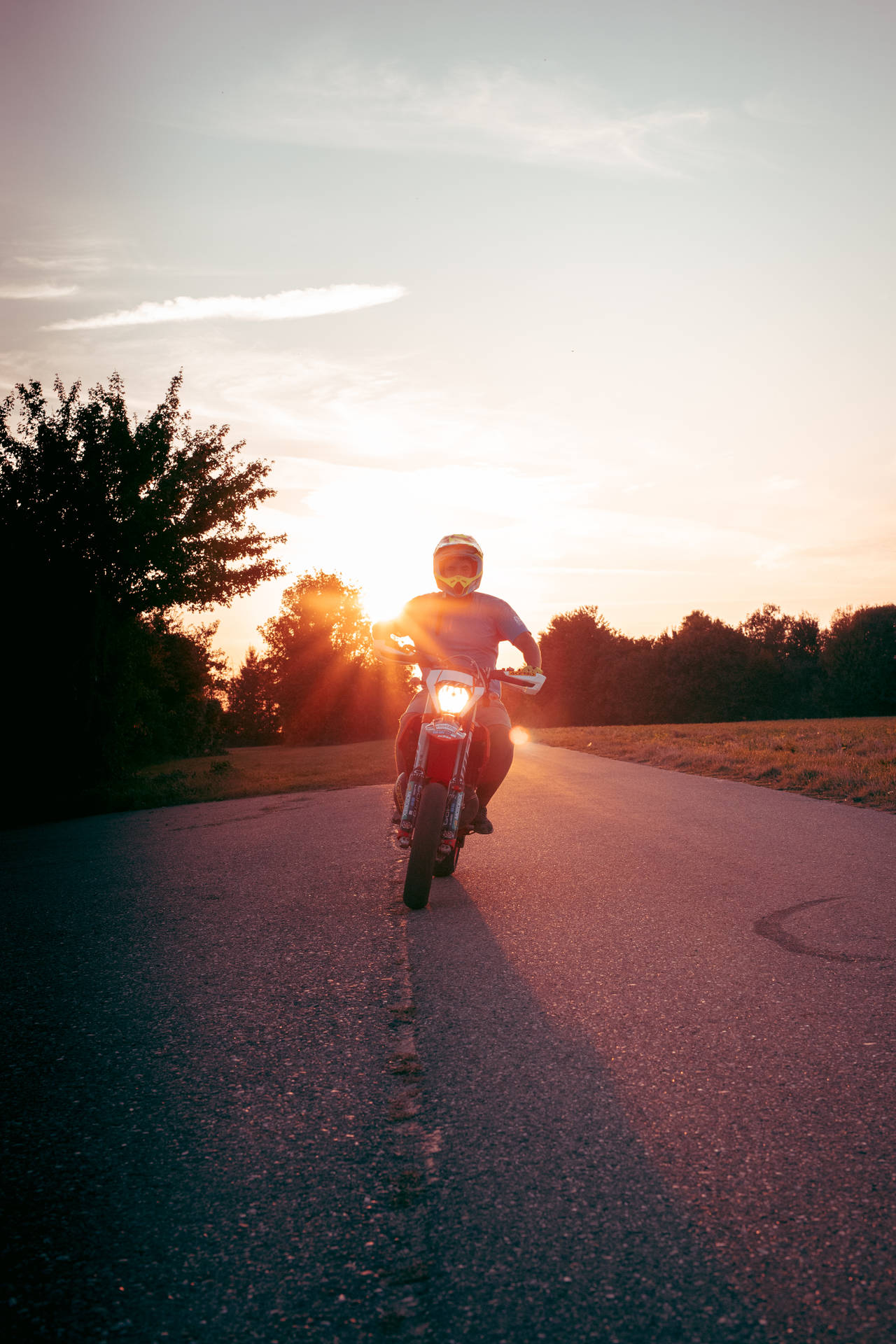 Ktm Bike Rider At Sunset Background