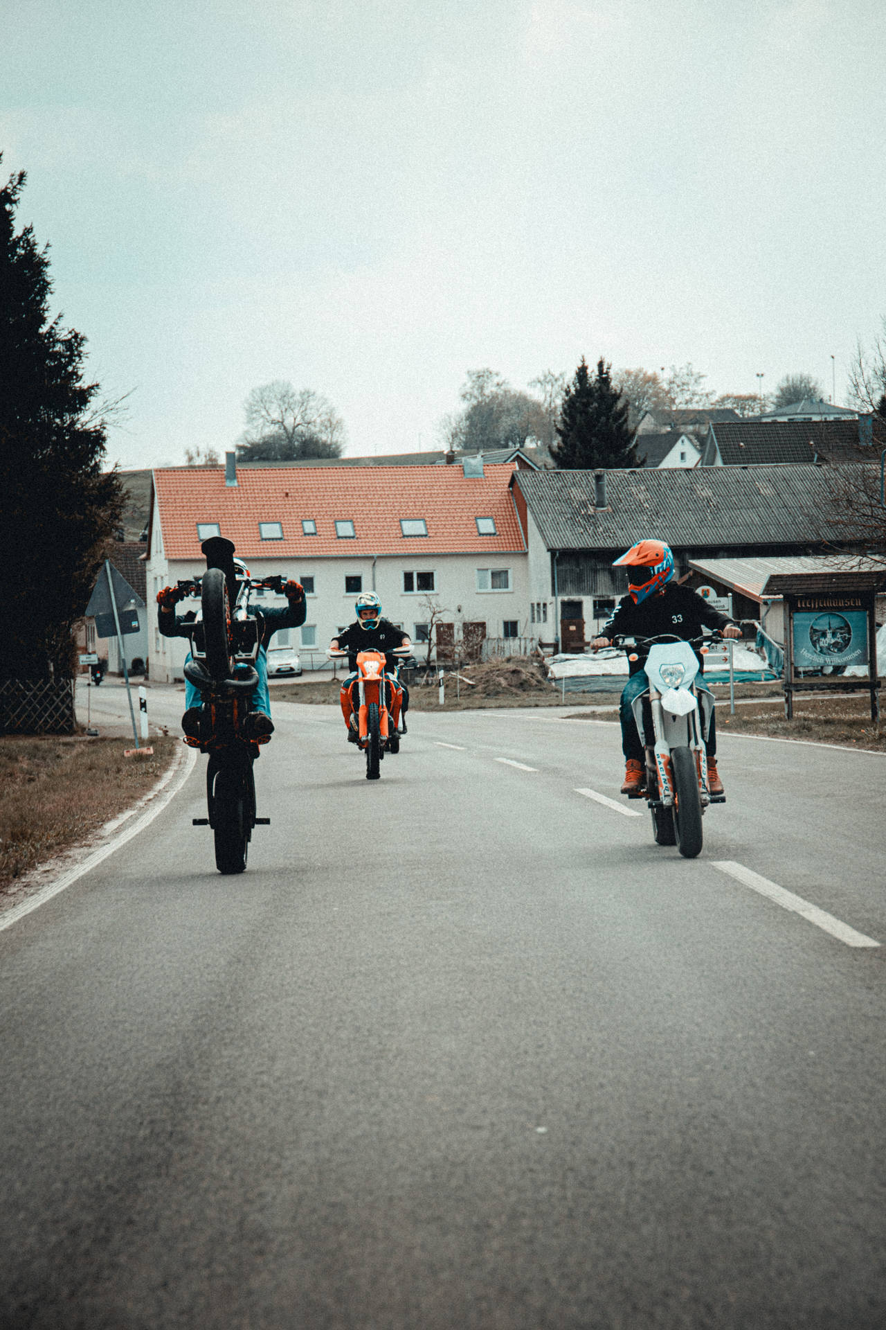 Ktm Bike Riding Trio Background