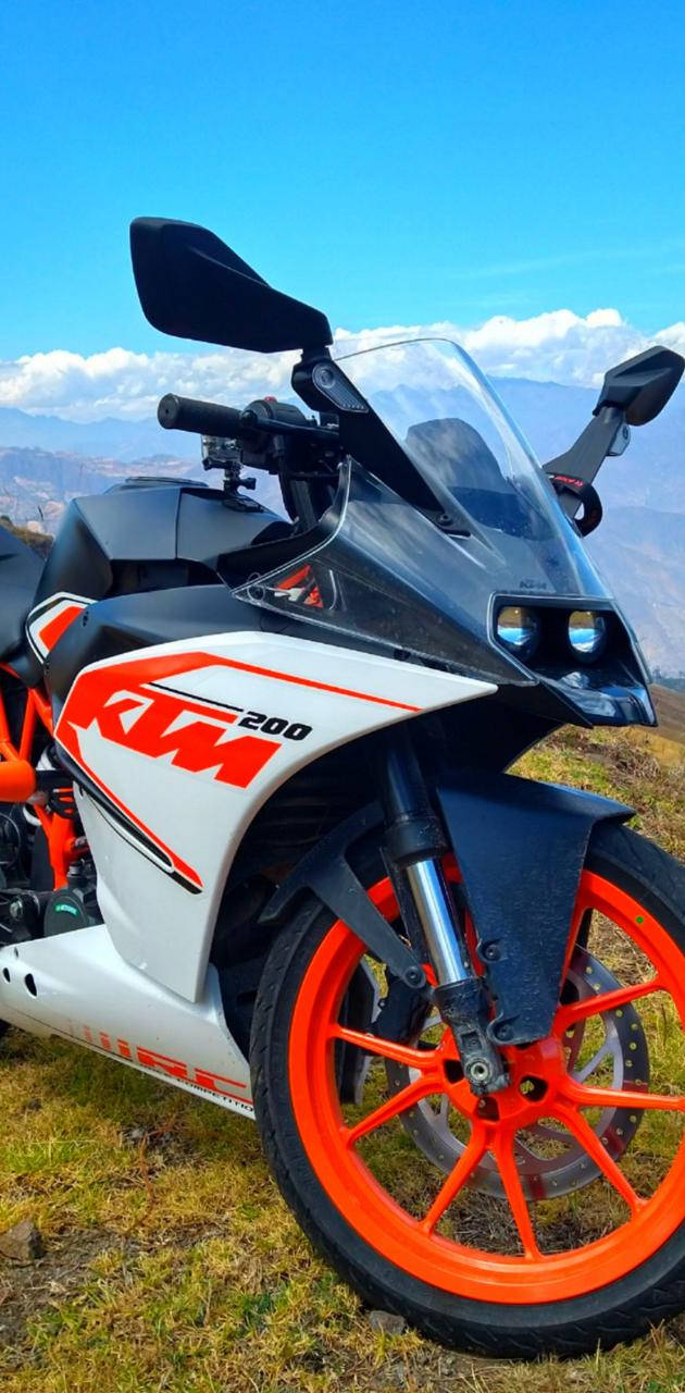 Ktm Rc 200 In Mountains Background