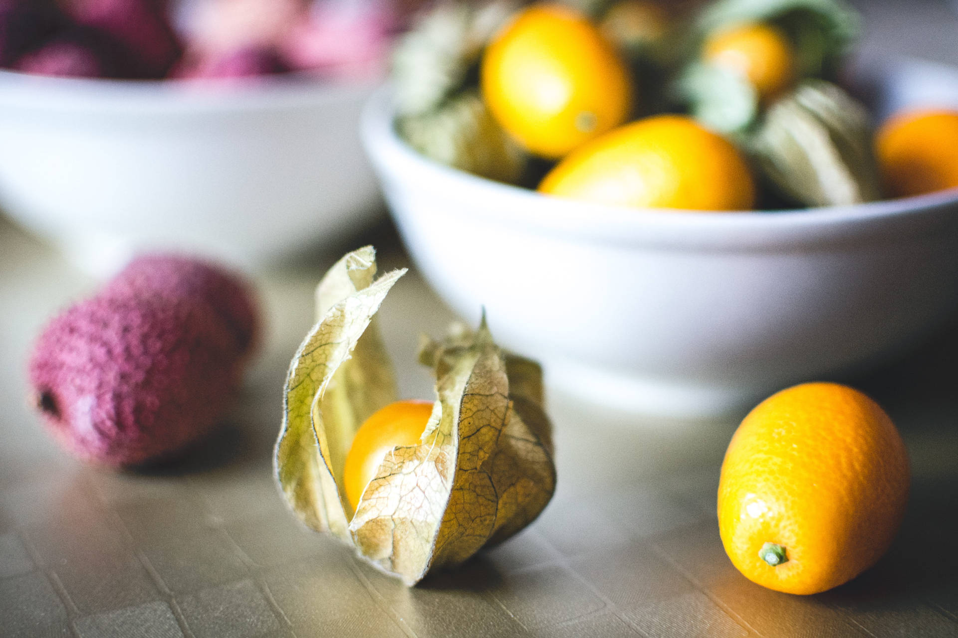 Kumquat And Lychee Fruits Eye Level Shot Background