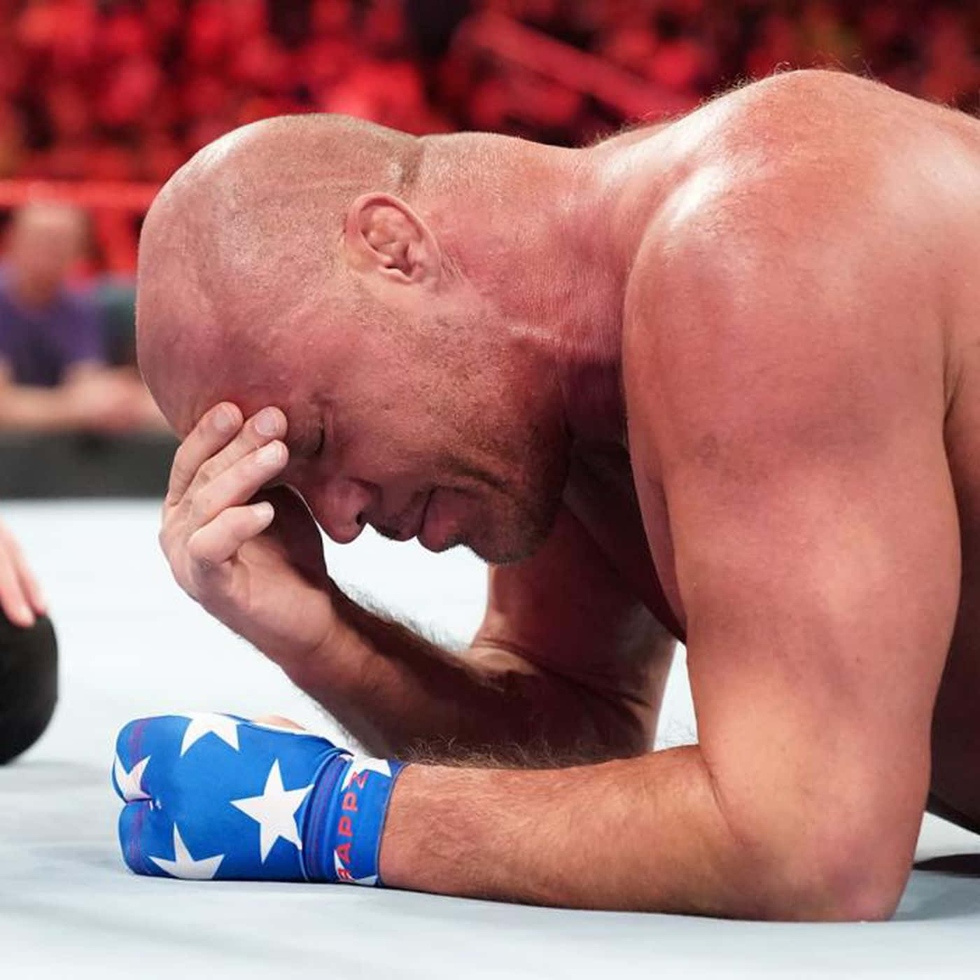 Kurt Angle Lying Prone In The Ring Background