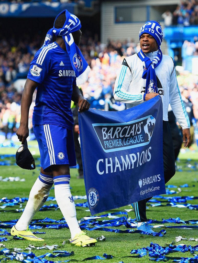 Kurt Zouma Holding Championship Banner Background