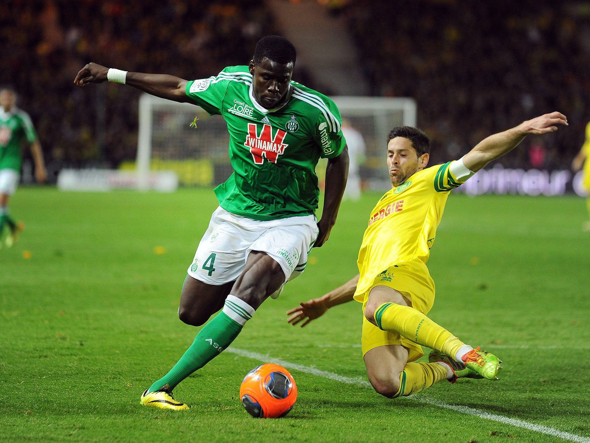 Kurt Zouma Kicking Orange Ball Background