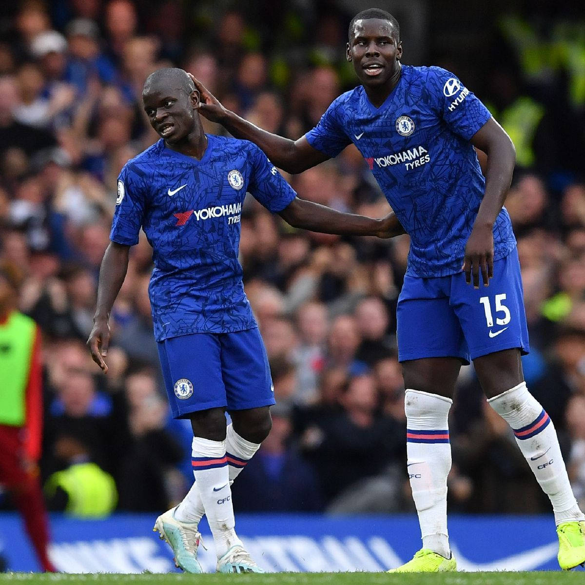 Kurt Zouma Touching Head Teammate Background