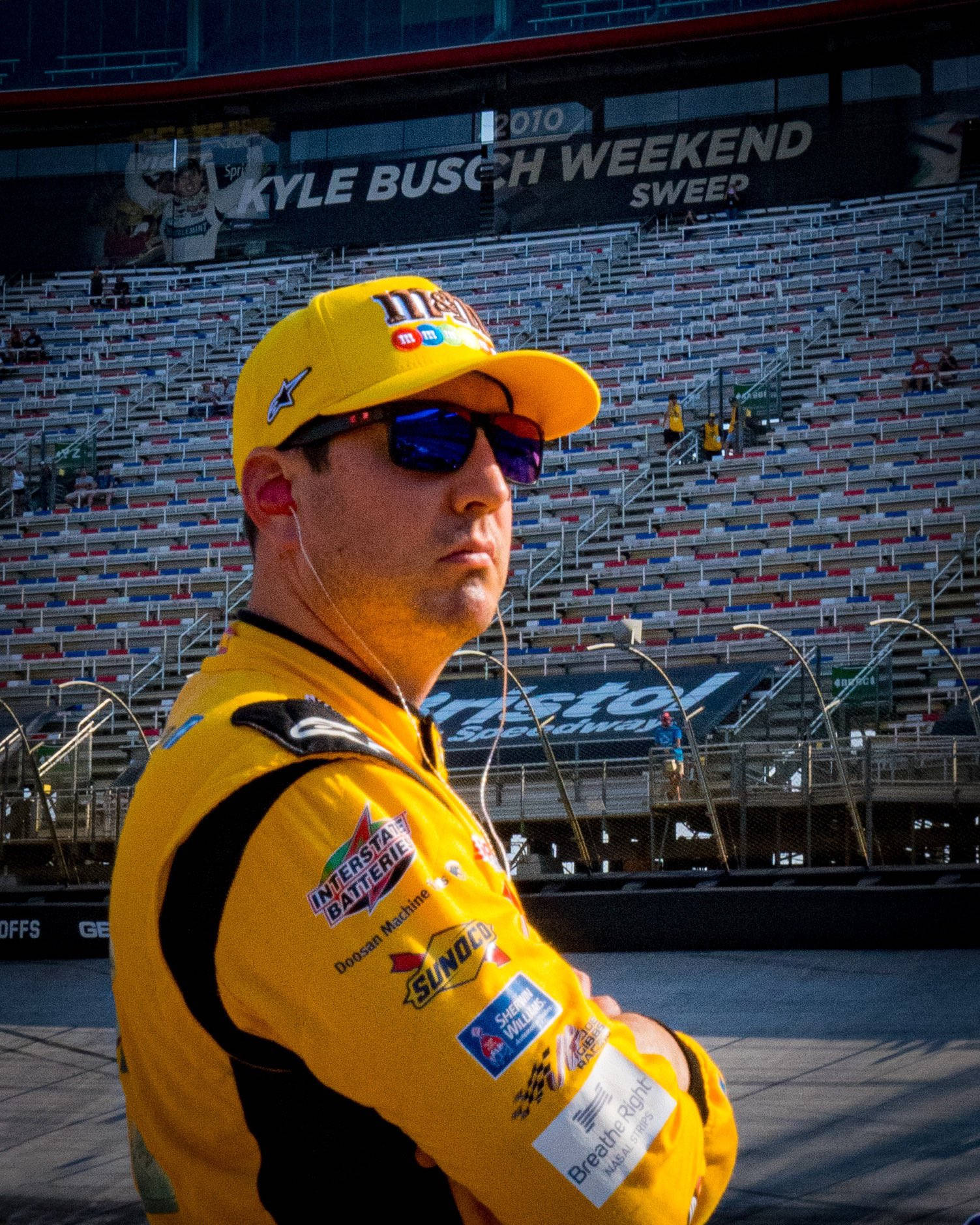 Kyle Busch In A Stadium Background