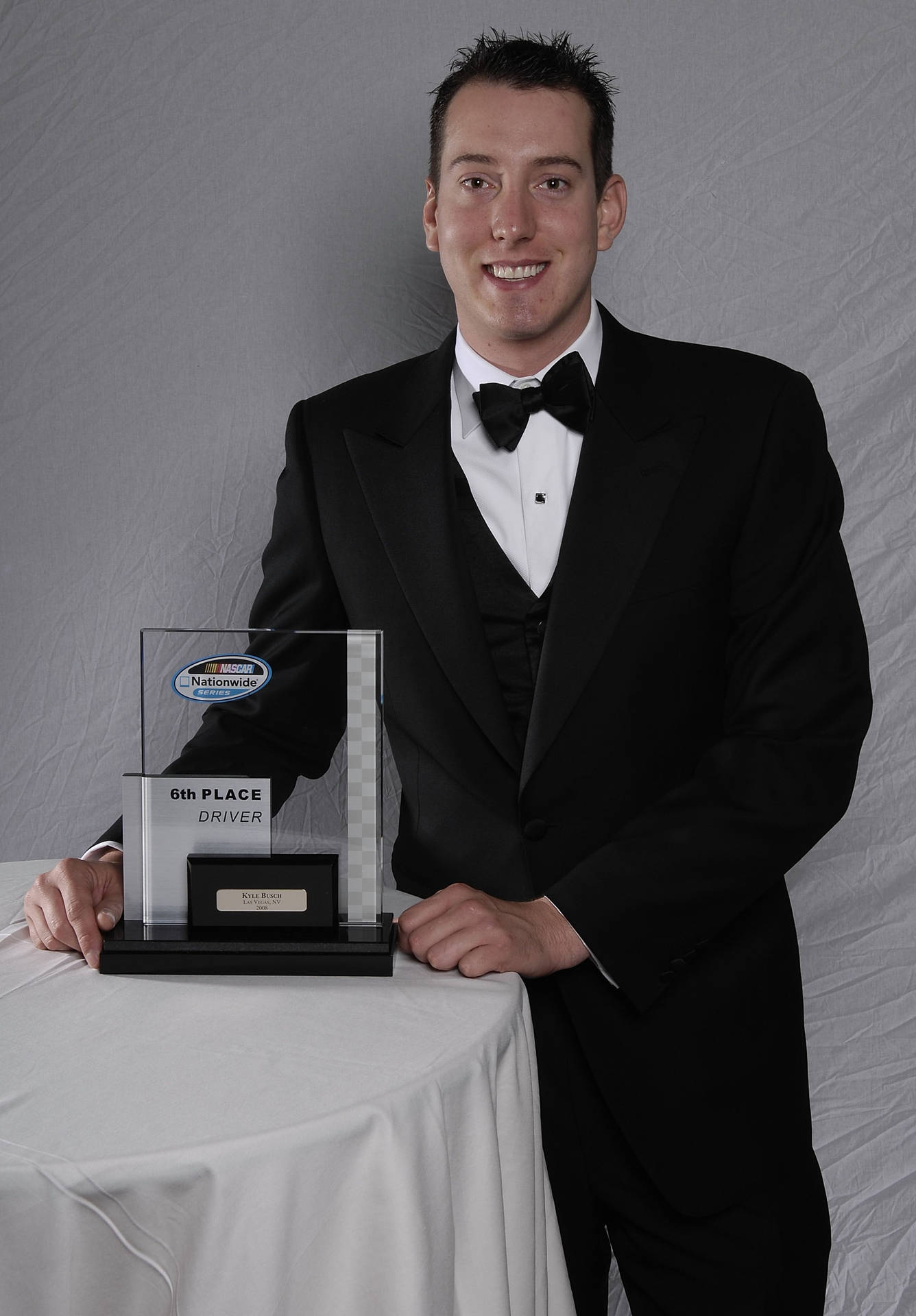 Kyle Busch In A Suit Background