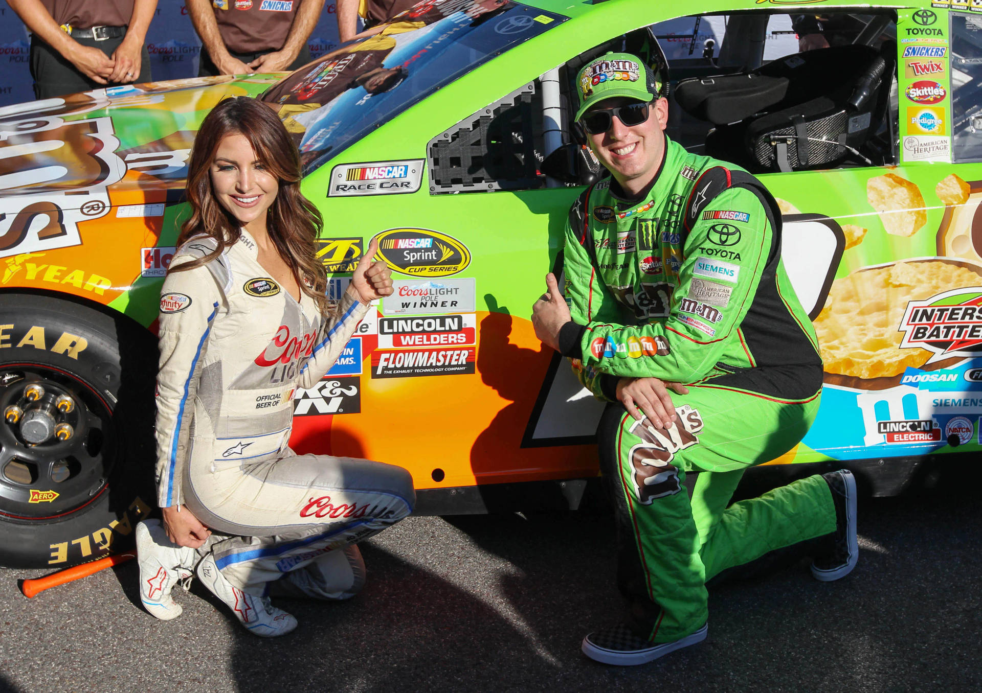 Kyle Busch In Green Suit Background