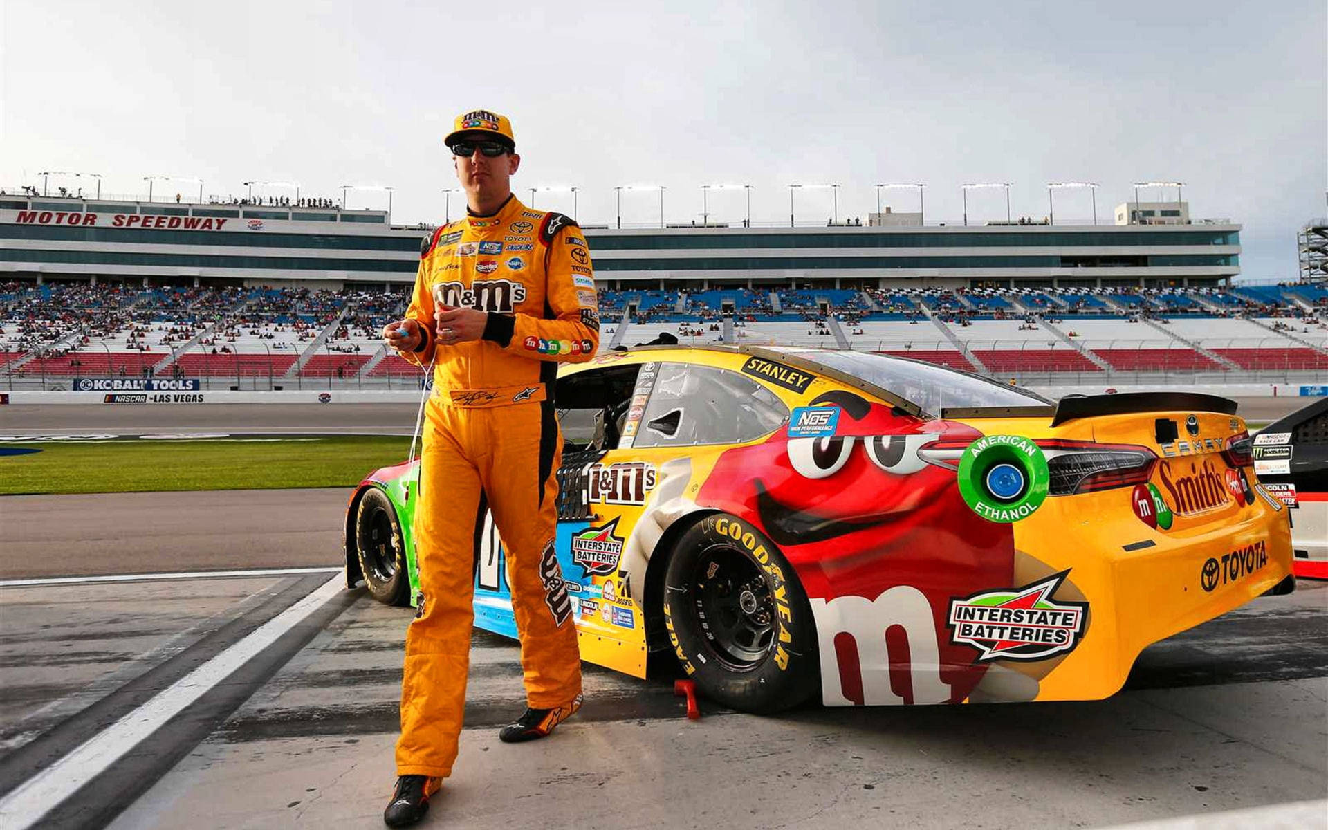 Kyle Busch In Yellow Suit Background