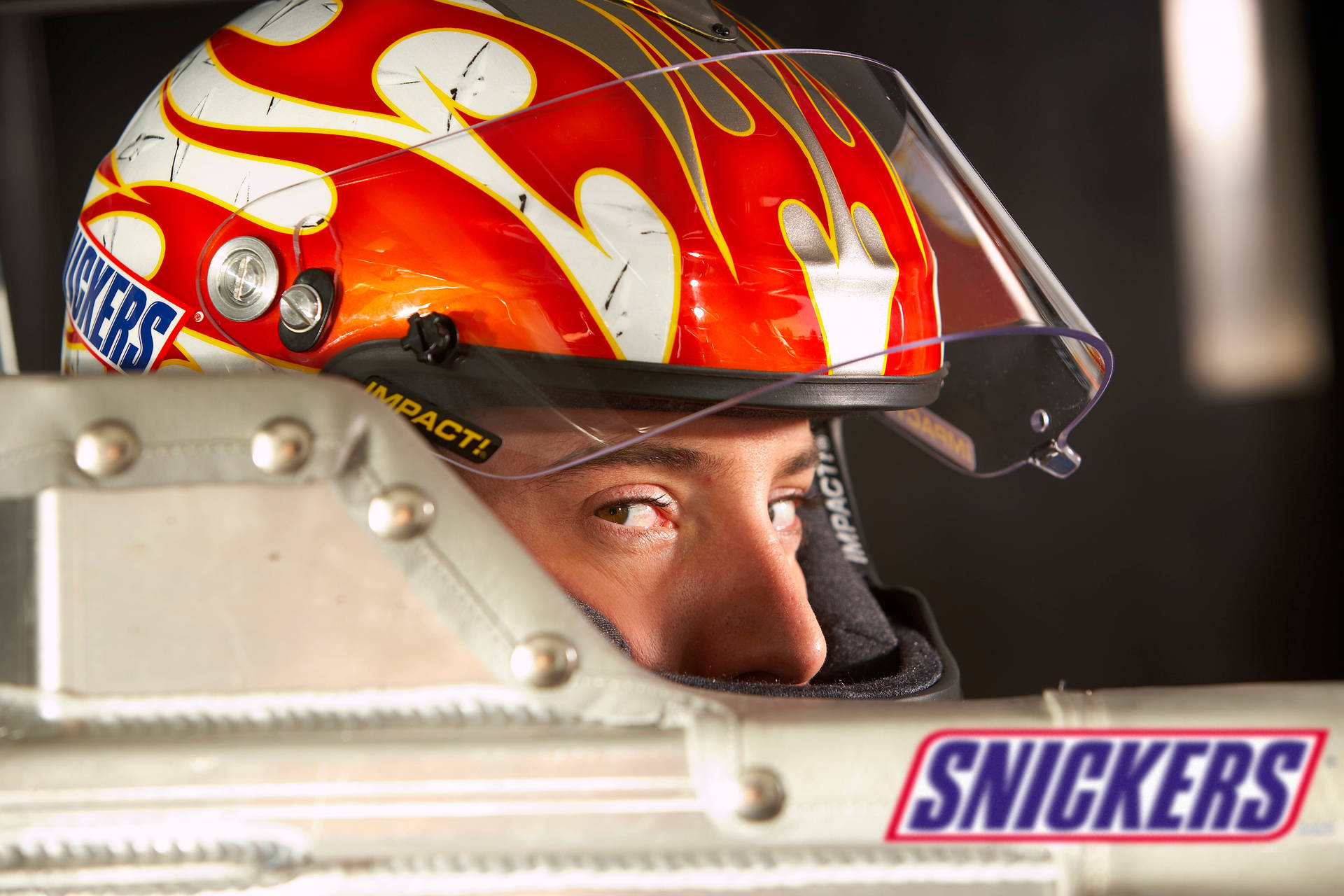 Kyle Busch Posed With The Snickers Logo On His Racing Gear.