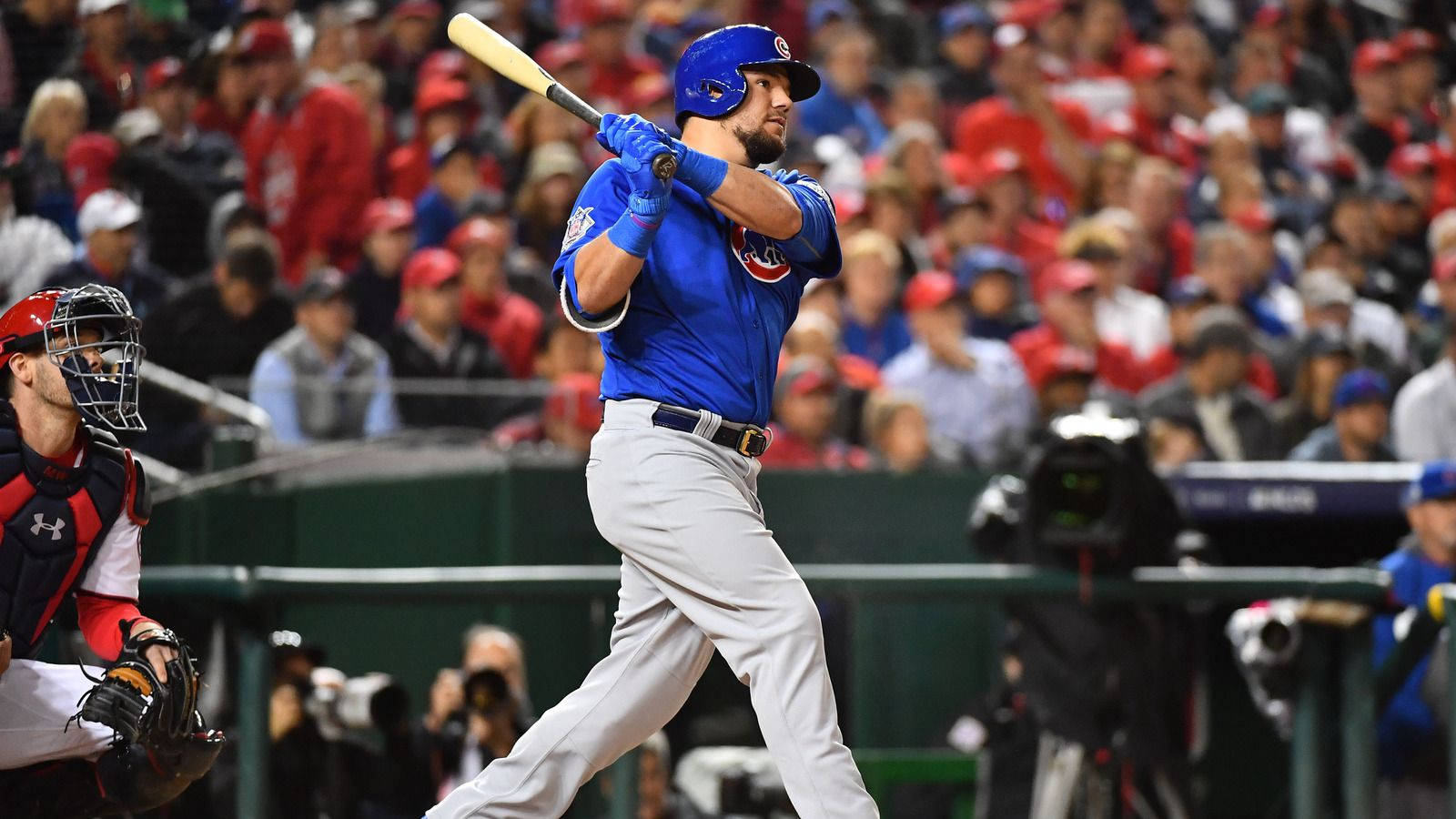 Kyle Schwarber Swinging In Blue