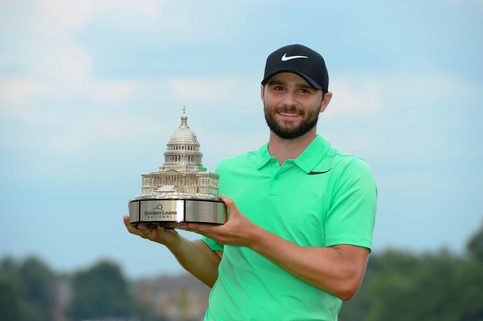 Kyle Stanley Holding A Golf Trophy Background
