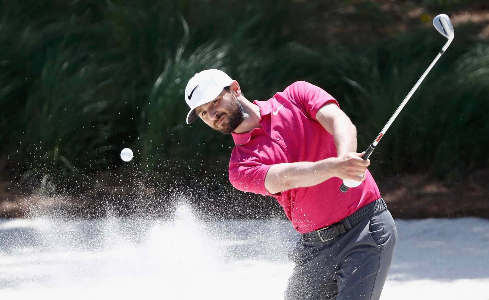 Kyle Stanley Skillfully Navigating A Sand Bunker Background