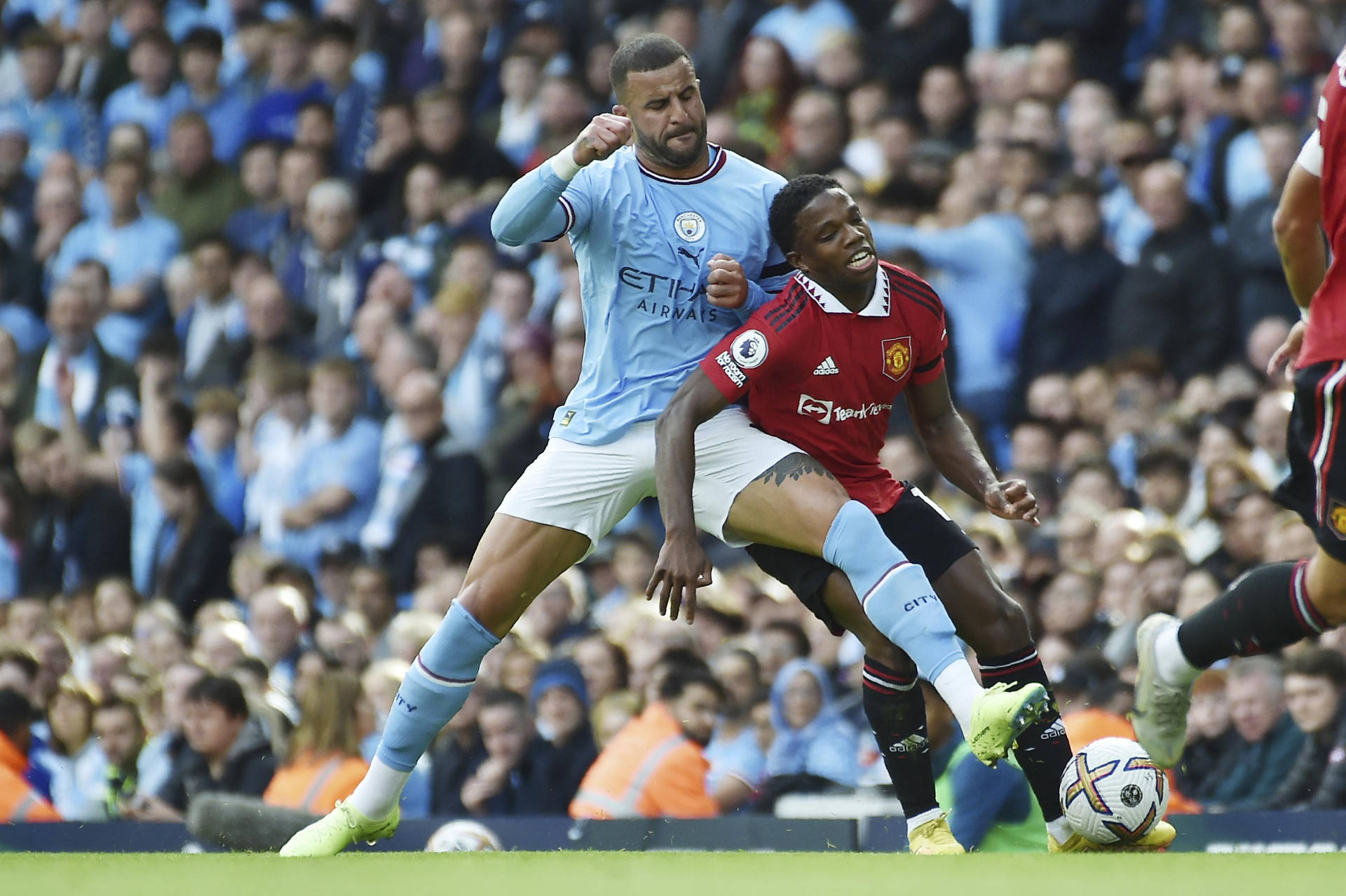 Kyle Walker In Action Against Tyrell Mings In A Tense Football Match.