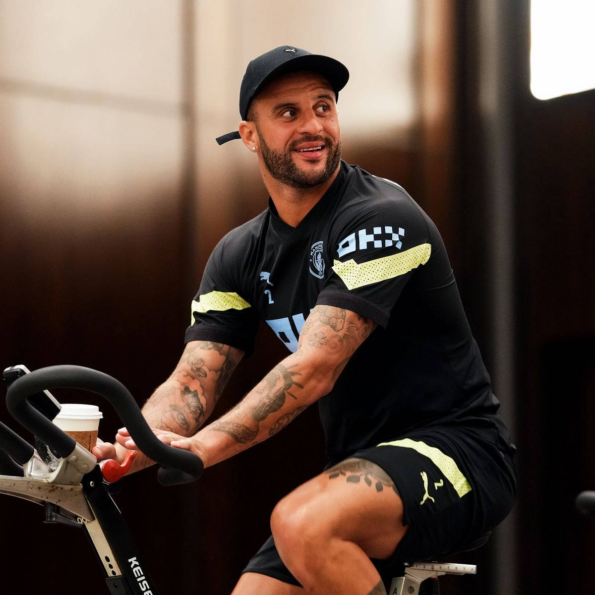 Kyle Walker Riding Stationary Bicyle Background