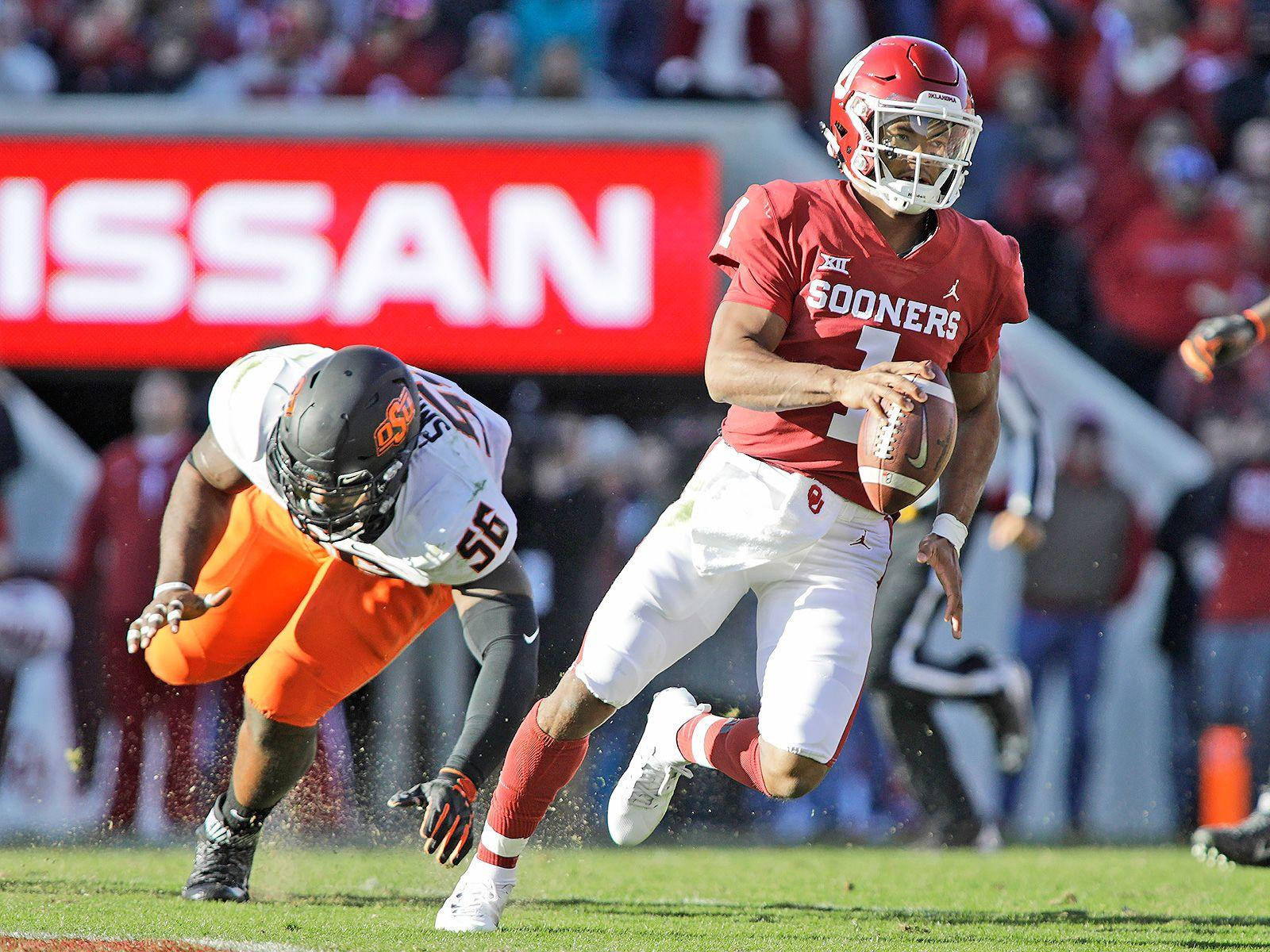 Kyler Murray Against Baron Browning Background