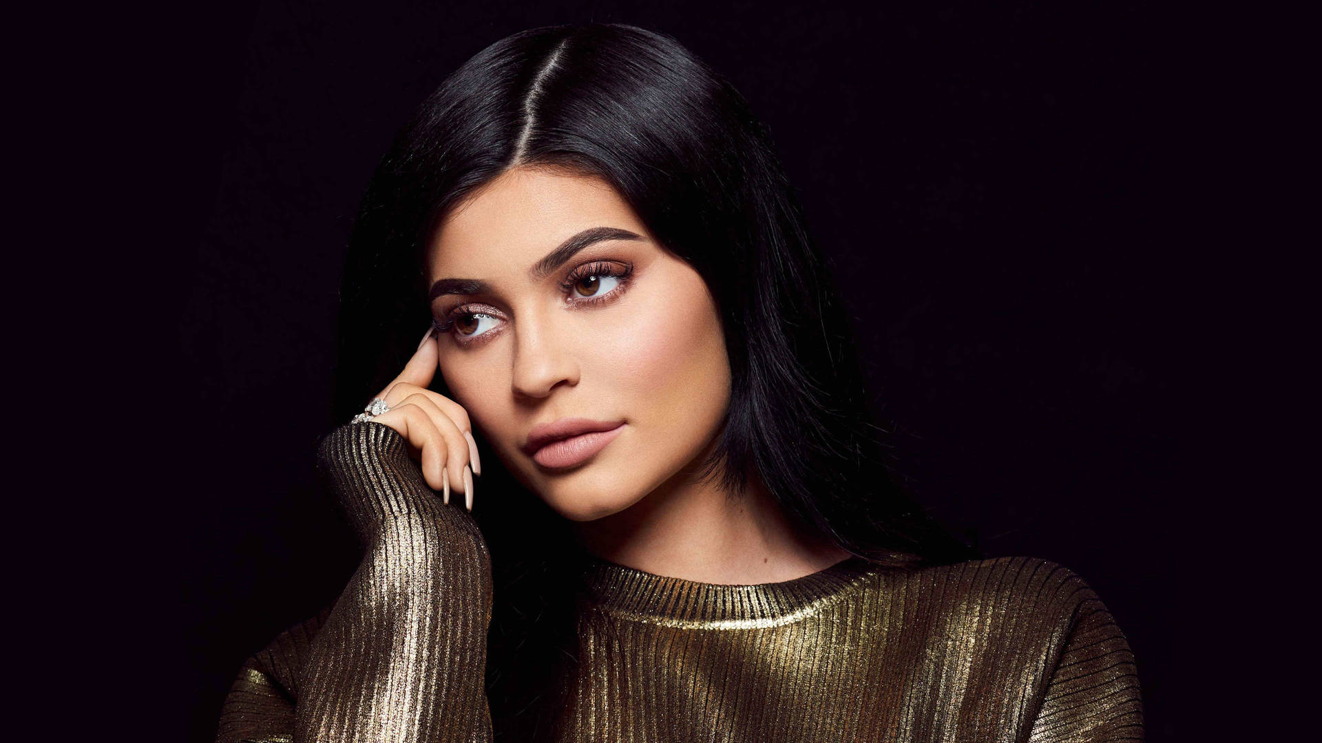 Kylie Jenner In Bronze Long Sleeve Background
