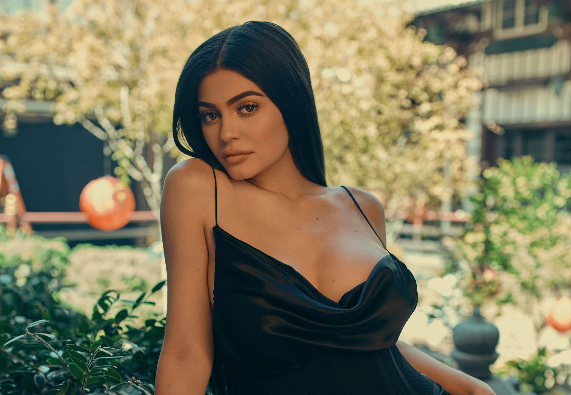 Kylie Jenner In Silk Black Dress Background