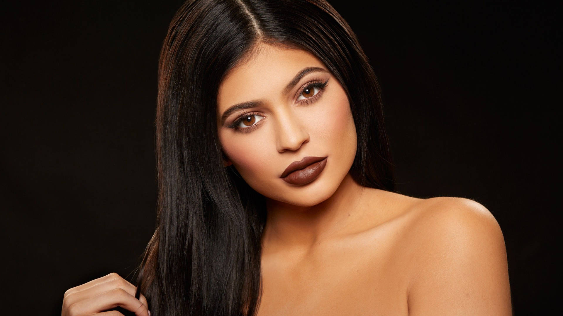 Kylie Jenner Wearing Deep Chocolate Lipstick Background