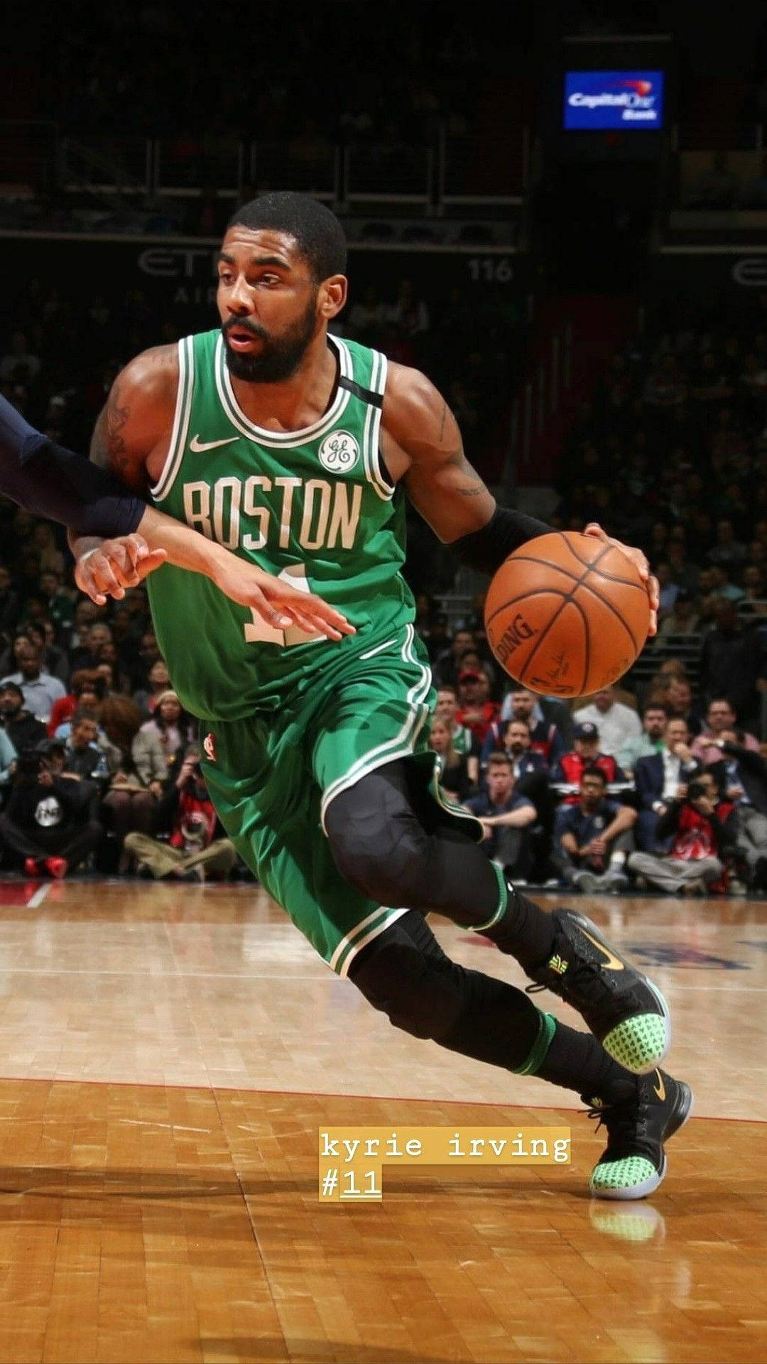 Kyrie Irving Playing On Basketball Tournament Background