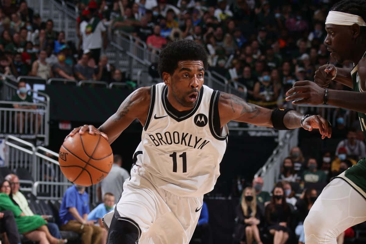 Kyrie Irving Taking The Court As A Brooklyn Net Background