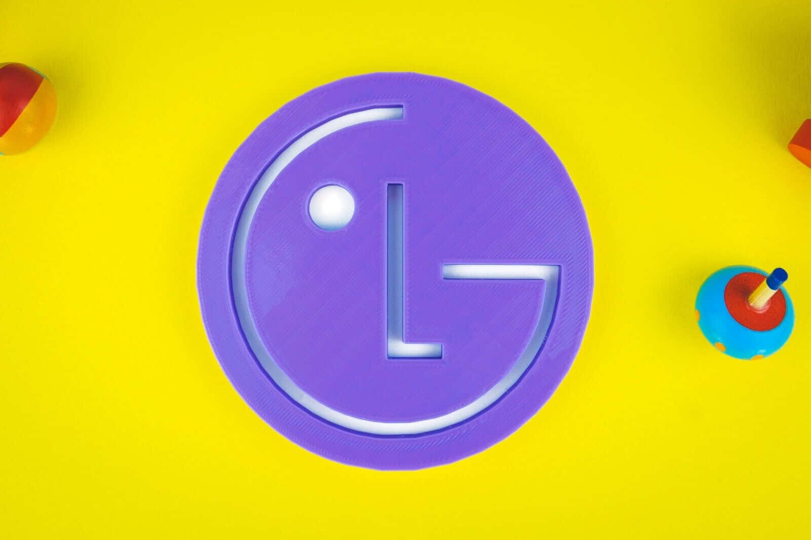 L G Logo Purpleon Yellow Background Background